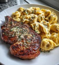 garlic butter steak with cheesy alfredo tortellini